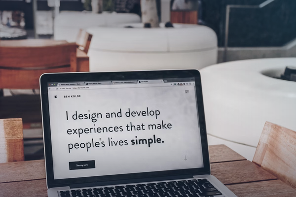 Laptop showing a modern website design for redesign article