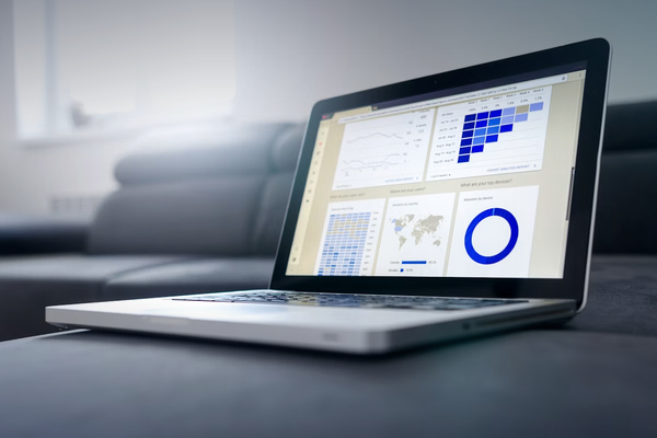 Laptop analytics dashboard representing quality and performance metrics